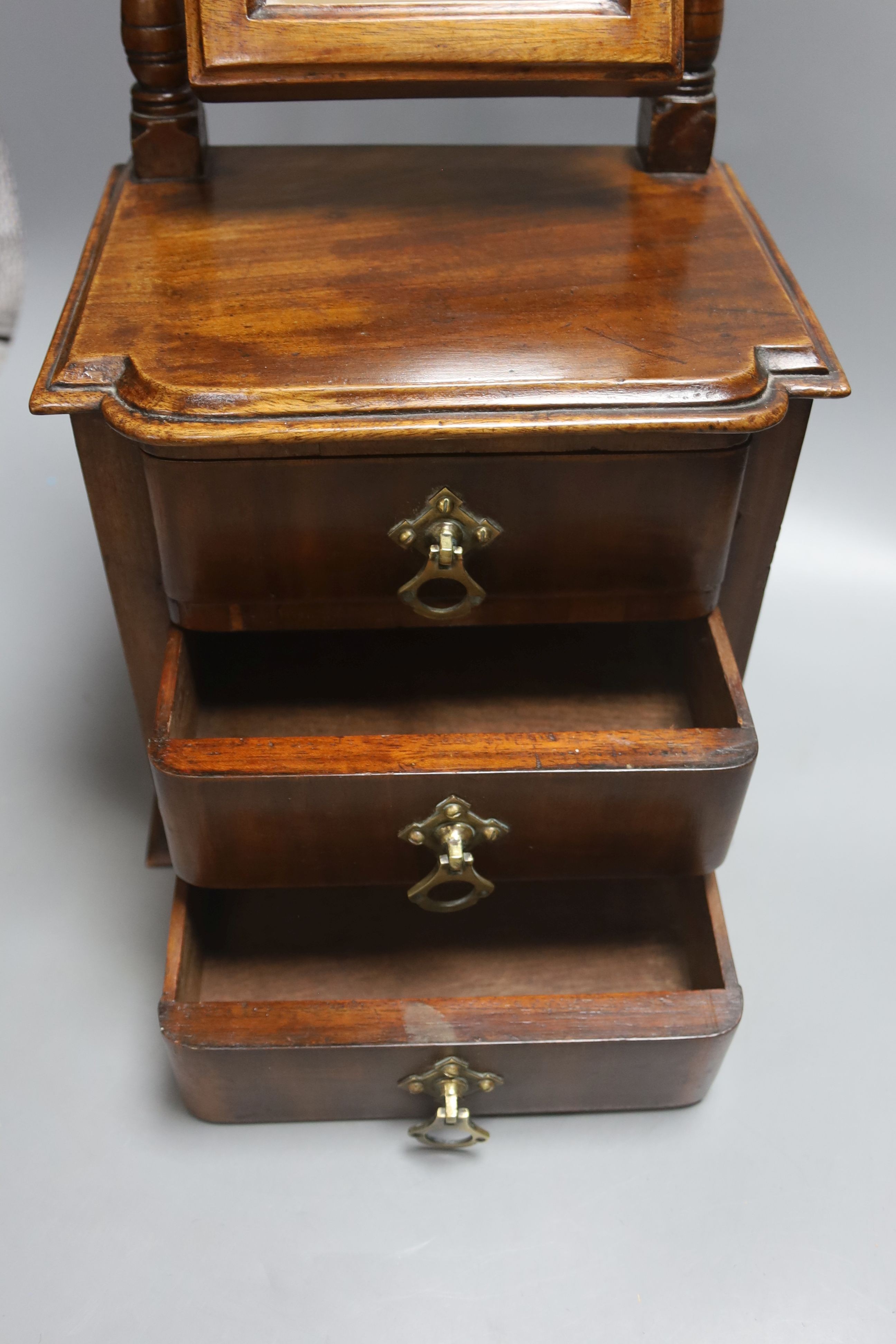 A Victorian walnut workbox and a miniature mahogany chest, height 42cm